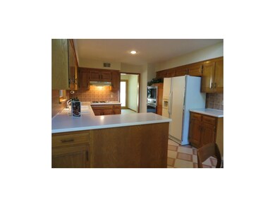 Kitchen has gas range newer tile back splash.