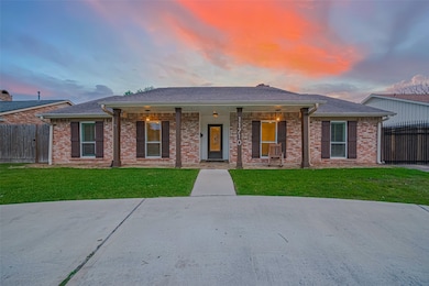This charming brick home features a welcoming fron