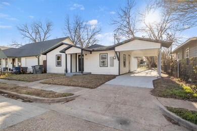 Ranch-style house featuring a carport