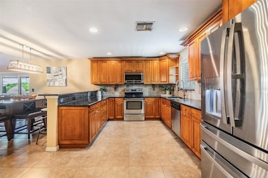 Stainless Steel Appliances, Granite Counter Tops and inset lighting