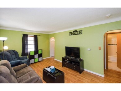 Large living room with newer laminate flooring and