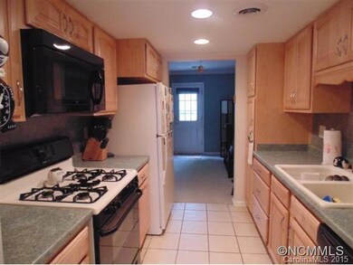 Galley Kitchen with tile floor