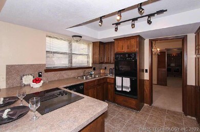 Kitchen has newer double ovens.