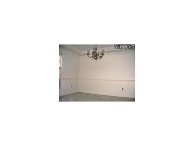 Dining room with crown molding and chair rail