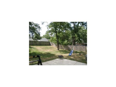 Exterior Back. Large Patio and Fenced Yard