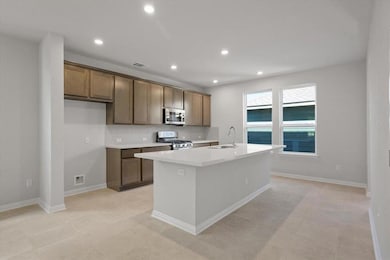 Kitchen featuring appliances with stainless steel