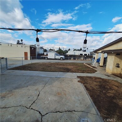 Concrete area in between house and storage area