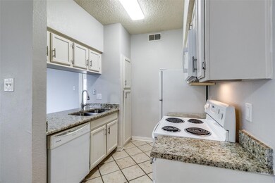 Kitchen with sink, white appliances, white cabinet