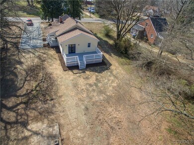 Bird's eye view shows off the large deck, perfect for grilling and entertaining. Very private.