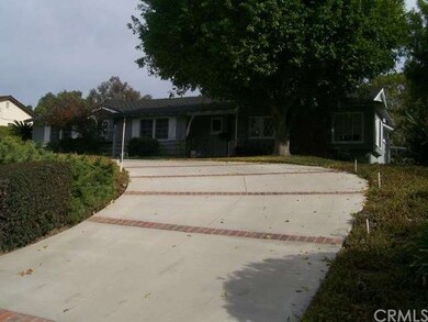 Front view - Circular Driveway with Brick Accents