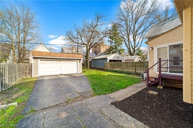 View of yard and 2 car garage