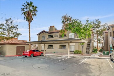 View of property featuring covered parking and stairway