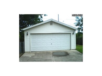 Newer (2001) 2 car garage with opener.  Note the nice concrete drive, also newer.