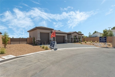 View of front of property with a gate, a garage, s