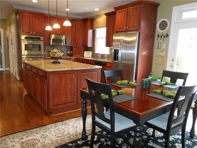 Kitchen and breakfast area leads to back patio