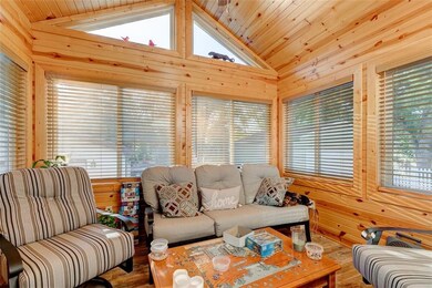 Sun porch with lots of windows & heated tile floor