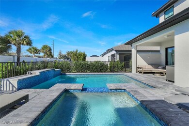 View of pool with an in ground hot tub, a patio ar