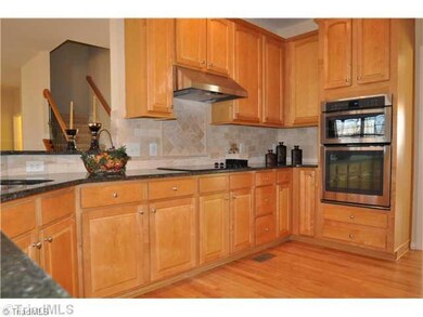 Kitchen. Wow! New stainless steel appliances and tile backsplash.