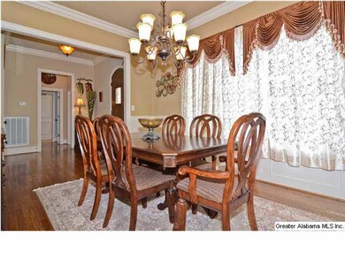 Spacious dining room opens to the foyer and kitche