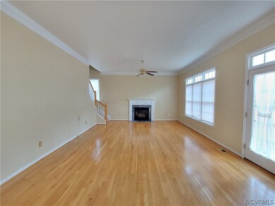 Family Room with a gas fireplace and a ceiling fan