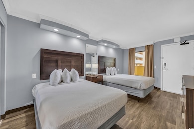Bedroom with recessed lighting, crown molding, bas