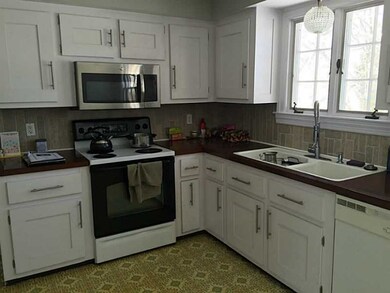 Kitchen. Bright sun filled kitchen with window ove