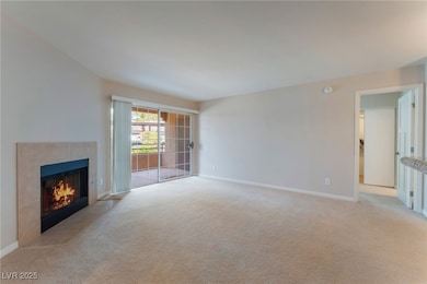 Unfurnished living room featuring carpet floors, a