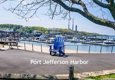 Dock area featuring a water view and view of marina