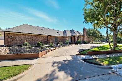 View of front side of house with circular driveway