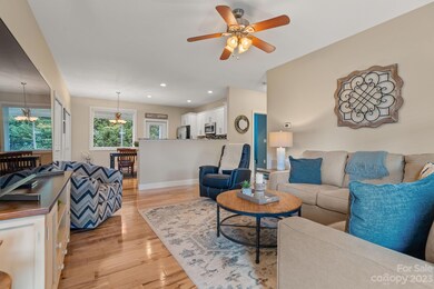 The open floor plan allows easy communication as the kitchen, dining and living areas share a common space.