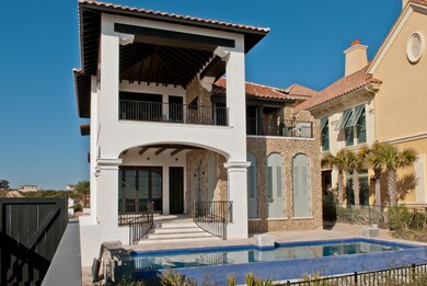 Gulf side of home with pool & loggia
