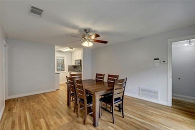 Dining area featuring light wood-type flooring, c