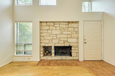 Unfurnished living room featuring wood finished f