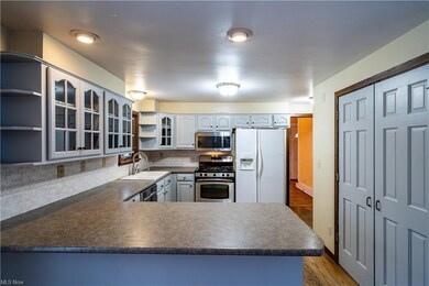 Kitchen with pantry opens to the family room