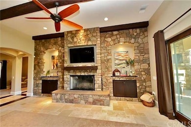Expansive stone accent wall with 2 lit art niches 