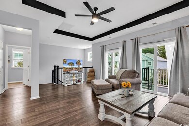 Living room with dark hardwood / wood-style floors