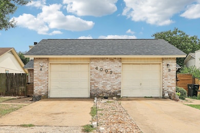 Garage featuring driveway