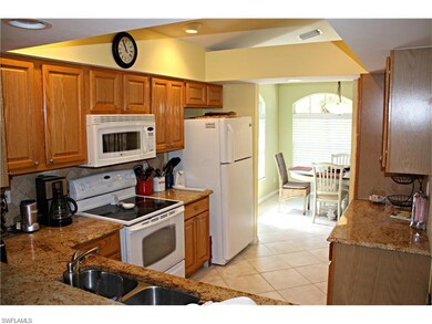 Kitchen with formal dining room in back ground
