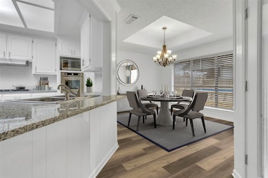 Kitchen wih recent grajnite countertop and separat