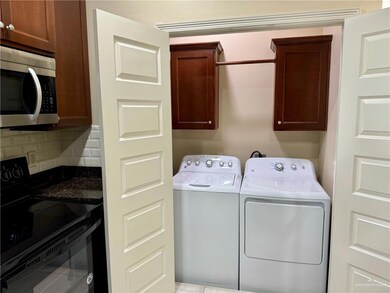 Laundry area with cabinets and washer and dryer