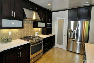 Gourmet kitchen with stainless steel appliances an