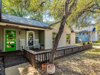 Inviting front deck you can enjoy under a canopy of mature trees.