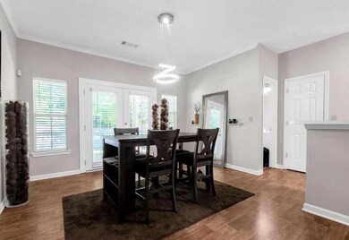 Dining room featuring french doors, wood finished 