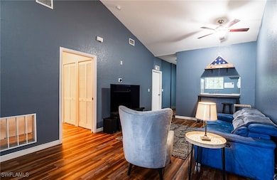 Living room with hardwood / wood-style flooring, c