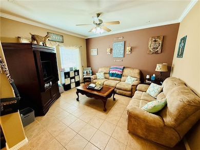 Living area featuring light tile patterned floors,
