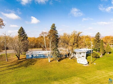 View of dock featuring a lawn