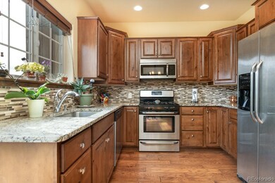 Rich granite counters, alder cabinetry and stainle