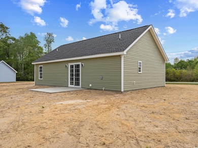 Back of house with a patio area
