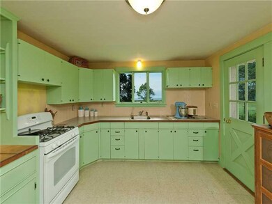 Kitchen. The kitchen leads out to...
