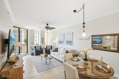 Tiled living room featuring ornamental molding and
